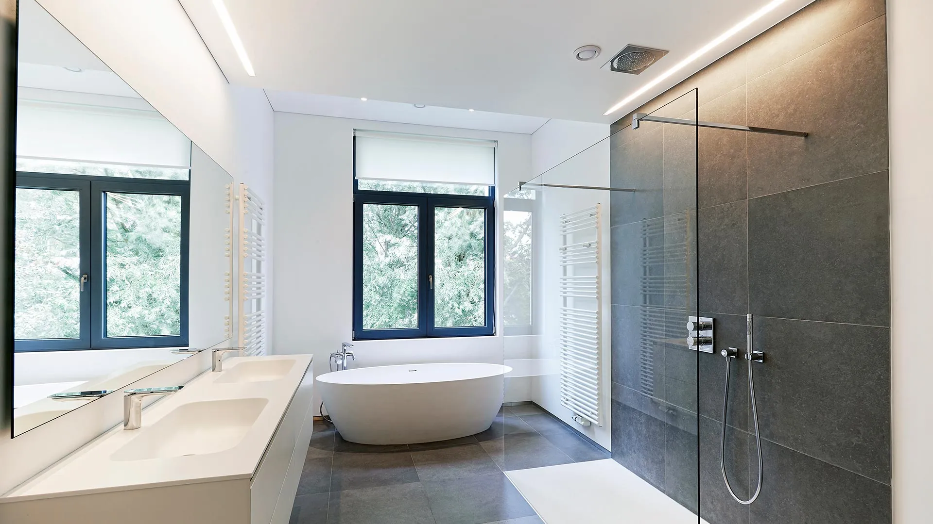 Modern bathroom with a white roller blind over the window